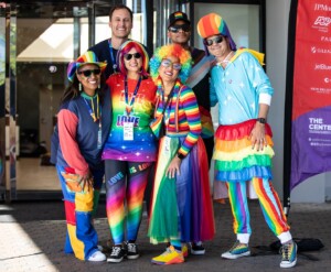 Powering LGBT Community people biking with smiles on their faces