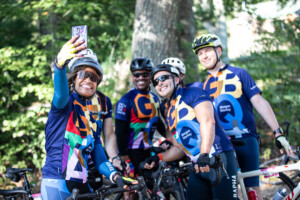 Team and Corporate people biking with smiles on their faces